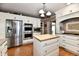 Bright kitchen featuring stainless steel appliances, custom cabinetry, and a butcher block island at 1910 Ivy Dr, Anderson, IN 46011