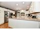 Bright, updated kitchen with stainless steel appliances, granite countertops and custom cabinetry at 1910 Ivy Dr, Anderson, IN 46011