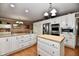 Spacious kitchen featuring stainless steel appliances, custom cabinets, an island, and breakfast nook at 1910 Ivy Dr, Anderson, IN 46011