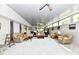 Spacious living room with multiple seating areas, ceiling fans, and ample natural light at 1910 Ivy Dr, Anderson, IN 46011