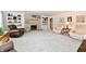 A spacious living room featuring a stone fireplace, comfortable seating, and elegant decor at 1910 Ivy Dr, Anderson, IN 46011