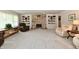 Open-concept living room featuring a fireplace, cozy seating, and stylish decor at 1910 Ivy Dr, Anderson, IN 46011