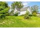 Spacious backyard showcasing the home's exterior and ample green space at 2009 S L St, Elwood, IN 46036