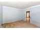 Bedroom featuring light blue wood paneled walls and doorway at 2009 S L St, Elwood, IN 46036