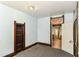 Empty bedroom with peeling paint and view into other rooms at 2009 S L St, Elwood, IN 46036