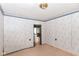 A bedroom is freshly painted with patterned wallpaper and hardwood trim at 2009 S L St, Elwood, IN 46036