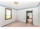 This bedroom is freshly painted with patterned wallpaper and hardwood trim at 2009 S L St, Elwood, IN 46036