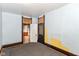 Empty bedroom with peeling paint and doors at 2009 S L St, Elwood, IN 46036