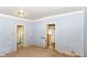 Bedroom featuring light blue wood paneled walls and multiple doorways at 2009 S L St, Elwood, IN 46036