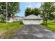 A view of the garage with two doors and an asphalt driveway at 2009 S L St, Elwood, IN 46036