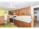 Outdated kitchen featuring a gas range and wood cabinets, plus unique flooring at 2009 S L St, Elwood, IN 46036
