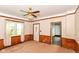 Living room featuring wood trim, window, and an exterior door at 2009 S L St, Elwood, IN 46036