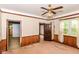 Living room with wood trim, ceiling fan, and natural light from a window at 2009 S L St, Elwood, IN 46036