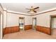 Living room featuring wood trim, and multiple doorways at 2009 S L St, Elwood, IN 46036