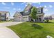 Beautiful two-story home with a three-car garage, a quaint front porch, and mature landscaping at , Westfield, IN 46074