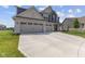 Spacious two-story home boasting a three-car garage, a well-maintained lawn, and charming curb appeal at , Westfield, IN 46074