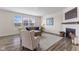 Inviting living room with a fireplace, hardwood floors, and lots of natural light from the windows at , Westfield, IN 46074