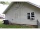 Exterior view of home with vinyl siding and trash bins at 2232 Fairview St, Anderson, IN 46016