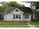 Charming single-story home with neutral siding, black roof and well-maintained lawn at 2232 Fairview St, Anderson, IN 46016