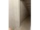 Unfinished basement featuring concrete walls and stairs at 2540 Lullwater Ln, Indianapolis, IN 46229