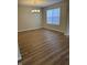 Well-lit dining room with modern chandelier and wood-look floors at 2540 Lullwater Ln, Indianapolis, IN 46229