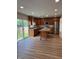 Bright kitchen featuring stainless appliances, a center island, and sliding doors to the fenced backyard at 2540 Lullwater Ln, Indianapolis, IN 46229
