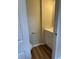 Powder room featuring wood-look floors, a white vanity, and a toilet at 2540 Lullwater Ln, Indianapolis, IN 46229