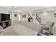 Basement entertainment area with wet bar, staircase, neutral carpet, and decor at 2614 Daylily Ct, Westfield, IN 46074