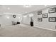 Finished basement with neutral carpet, chair, television, and motorcycle decor at 2614 Daylily Ct, Westfield, IN 46074