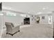 Finished basement with neutral carpet, chair, television, and decor at 2614 Daylily Ct, Westfield, IN 46074