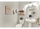 Charming bathroom with pedestal sink, toilet, and decorative wall art at 2614 Daylily Ct, Westfield, IN 46074