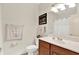 Bright bathroom featuring a wood vanity with a white sink, framed mirror, and neutral walls at 2614 Daylily Ct, Westfield, IN 46074