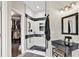 Sleek bathroom with black hardware, a walk-in shower with a glass enclosure, and a vanity area with storage at 2614 Daylily Ct, Westfield, IN 46074