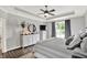 Bright bedroom featuring a dresser, two night stands, a large window, and a comfortable bed with neutral tones at 2614 Daylily Ct, Westfield, IN 46074