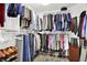 Organized walk-in closet featuring ample hanging space, shelving, and shoe racks for efficient storage and organization at 2614 Daylily Ct, Westfield, IN 46074