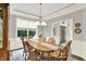 Dining room with wood table and decorative chandelier at 2614 Daylily Ct, Westfield, IN 46074