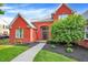 Charming red brick home with a well-kept lawn, walkway, and vibrant landscaping at 2614 Daylily Ct, Westfield, IN 46074