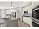 Bright kitchen featuring stainless steel appliances, granite countertops, and light gray walls at 2614 Daylily Ct, Westfield, IN 46074