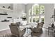Bright living room featuring a fireplace, built-in shelving, and large windows overlooking the backyard at 2614 Daylily Ct, Westfield, IN 46074