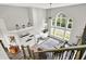 Open-concept living room with high ceilings, fireplace, and large arched windows at 2614 Daylily Ct, Westfield, IN 46074