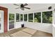 Sun room with wood floors, a ceiling fan, and a view of green trees through large windows at 2614 Daylily Ct, Westfield, IN 46074