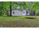 A bright and spacious backyard features a trampoline and ample room for outdoor activities and leisure at 2640 S Silcox Rd, Paragon, IN 46166