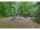 This cozy backyard features a picnic table, fire pit, and seating area, making it perfect for gatherings at 2640 S Silcox Rd, Paragon, IN 46166
