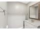 Standard bathroom featuring a sink with a mirror, towel rack and a white door at 2640 S Silcox Rd, Paragon, IN 46166
