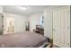 Spacious bedroom featuring neutral walls, light carpet and a doorway to the bathroom at 2640 S Silcox Rd, Paragon, IN 46166