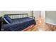 Bedroom featuring laminate flooring, light colored walls and a metal bed frame at 2640 S Silcox Rd, Paragon, IN 46166