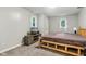 Relaxing bedroom with a wooden bed frame, television, and neutral carpet at 2640 S Silcox Rd, Paragon, IN 46166