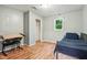 Bedroom featuring light colored walls, laminate flooring, closet and metal bed frame at 2640 S Silcox Rd, Paragon, IN 46166