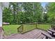 Spacious wooden deck offers a relaxing outdoor space with view of the lush lawn at 2640 S Silcox Rd, Paragon, IN 46166
