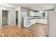 Bright kitchen with white cabinets, appliances, and hardwood floors at 2640 S Silcox Rd, Paragon, IN 46166